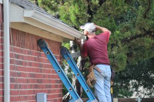 A DIY'er who repairs gutters