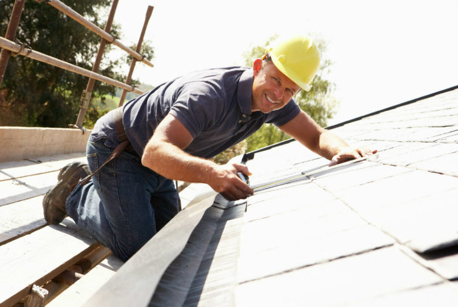Roofer repairing a roof